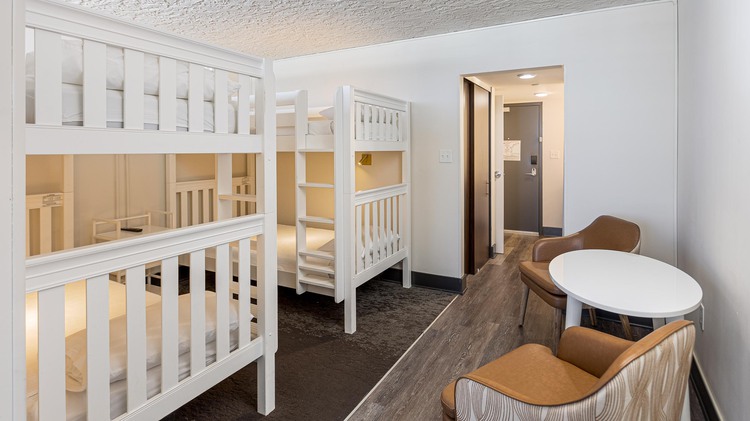 Two twin bunks with table and chairs